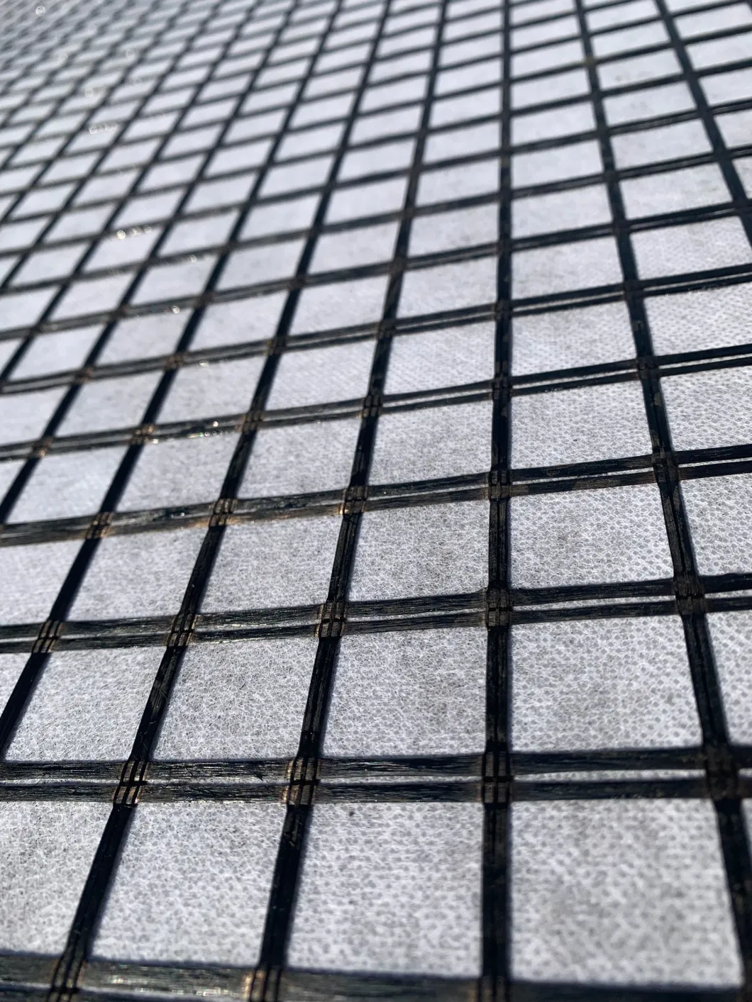 Asphalt Reinforcement Composite Pet Geogrid with PP Staple Fiber Needlepunched Nonwoven Geotextile Combined Geogrid Geotextile