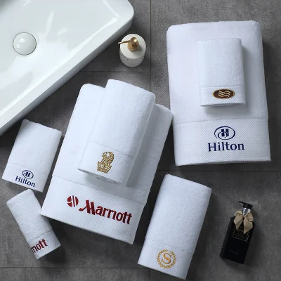 Ricamo con logo personalizzato di alta qualità, biologico 100 Cotton White Hilton Set di asciugamani per l′hotel bagno lussuoso lavatrice per il viso dell′hotel Asciugamani
