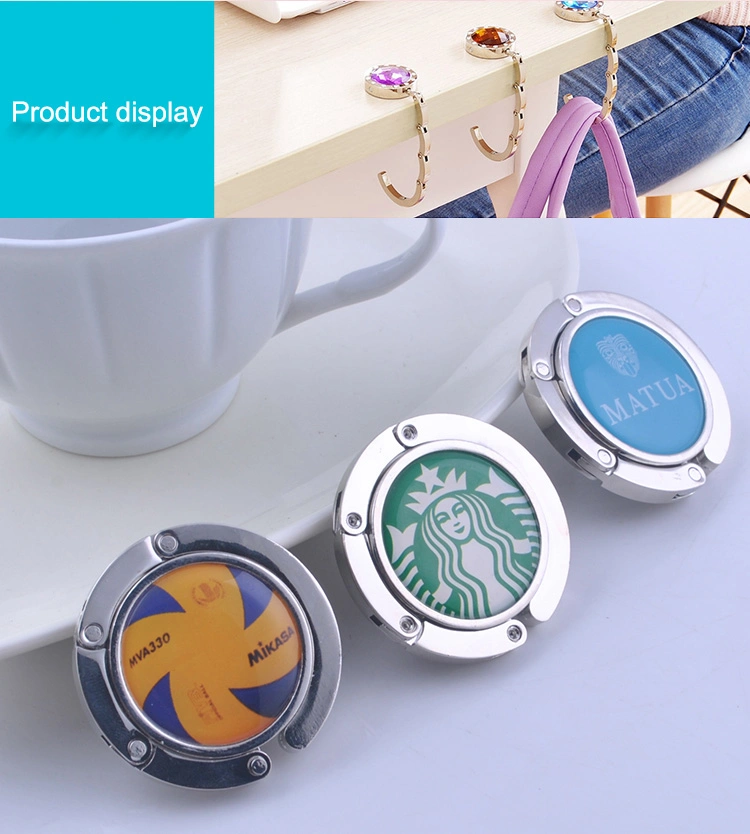 Creative Design Promotional Custom Logo Fashion Bag Table Top Folding Instant Purse Hook Handbag Hanger Holder Portable Foldable Hand Metal Ladies Bag Hanger