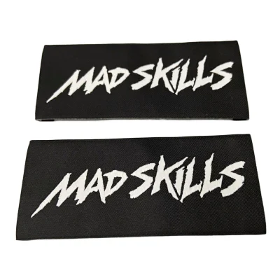 Etichetta di abbigliamento OEM Logo personalizzato marchio Accessori per indumenti piegati in tessuto Etichetta