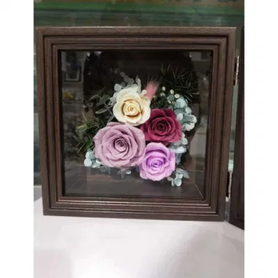 Cornice fotografica conservata con fiori conservati di alta qualità per la decorazione