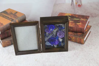 Cornice fotografica conservata con fiori conservati di alta qualità per la decorazione
