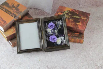Cornice fotografica conservata con fiori conservati di alta qualità per la decorazione