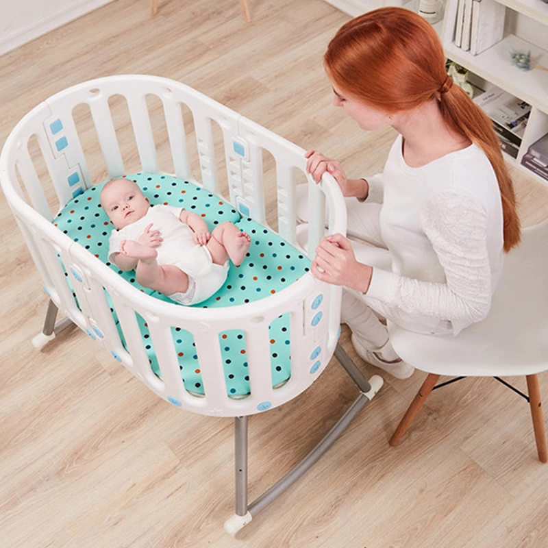 Multifunctional Baby Oval Crib for Newborn Baby Convitible to a Desk