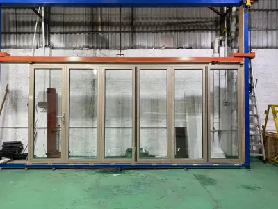  Foshan Commercio all&prime;ingrosso di finestre e porte materiale da costruzione Casa esterna moderna Ingresso anteriore patio scorrevole in alluminio pieghevole in vetro a prova di proiettile Bi-Fold Porta