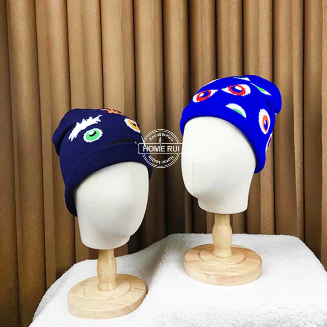 Designer Low MOQ Hats Custom Logo Knitted Monster Face Eyes Feather Eyebow Teeth Jacquard Skully Kids Cartoon Winter Cap Beanie