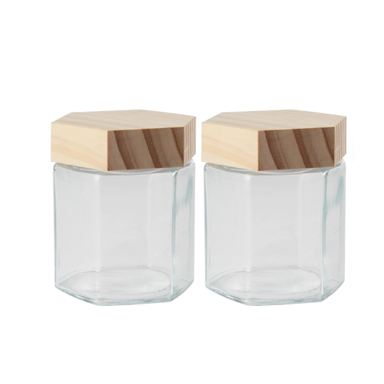 Wholesale Clear Fashion 4oz 6oz Honeycomb Shape Hexagonal Glass Storage Pot Cruet Spice Herb Honey Jar with Wooden Dipper and Bamboo Lid