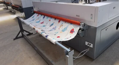 Auto Feeding CO2 Swimsuit Laser Cutting Machine 1812 130W Laser Textile Cutter with CCD Camera Positioning.