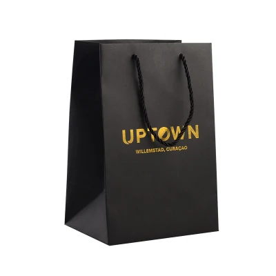 Bolsas de papel para compras personalizadas con asa de cinta de papel negro y lazo, con papel de tarjeta dorada para ropa interior, prendas de vestir, zapatos y ropa.