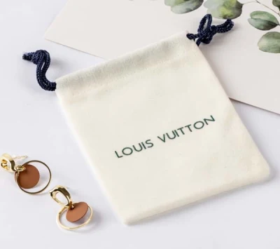 Bolsa de joyas de terciopelo azul con cordón ajustable de ante con logotipo plateado Bolsa de regalo