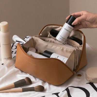 Bolsa de maquillaje pequeña y de color personalizada PU Travel Bolsa de cosméticos portátil Bolsa cosmética resistente al agua