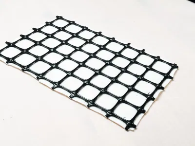 Extruded PP Biaxial Geogrid Heated Bonded to a Pet Long Fiber Nonwoven Geotextile Pet PP Short Fiber Nonwoven Geotextile