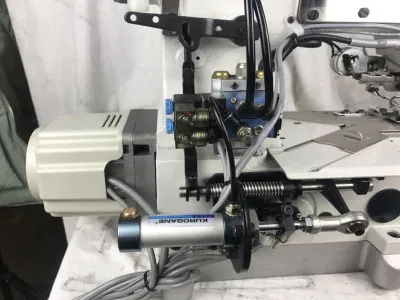 Máquina de coser de bloqueo de alta velocidad (izquierda), el Barbero de tela