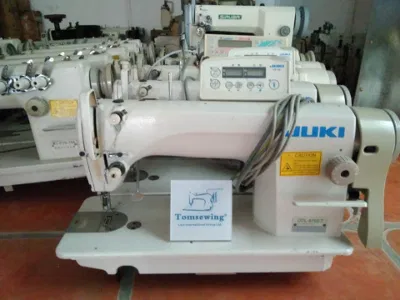 Máquina de coser de segunda mano con accionamiento directo, cortahilos automático y puntada de bloqueo Juki Ddl 8700-7.