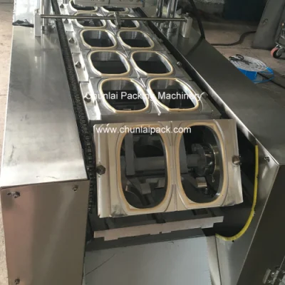 Envasado de alimentos comidas preparadas Autocalentamiento de bandejas de arroz sellado y llenado Máquina
